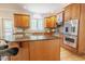 This kitchen features stainless steel appliances, a double oven, and lots of light from a large window at 1005 Hidden River Ct, Raleigh, NC 27614