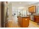 Spacious kitchen with stainless steel appliances, wood cabinets, and granite countertops at 1005 Hidden River Ct, Raleigh, NC 27614