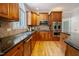 This gourmet kitchen offers granite countertops, a stainless oven, and tons of cabinet space at 1005 Hidden River Ct, Raleigh, NC 27614