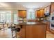 Bright kitchen boasts a functional layout, granite counters, an island and modern appliances at 1005 Hidden River Ct, Raleigh, NC 27614