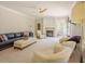 Large living room features comfortable seating, fireplace, and plenty of natural light at 1005 Hidden River Ct, Raleigh, NC 27614