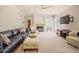 Open living room with a fireplace, comfortable seating, and a TV console, offering ample space at 1005 Hidden River Ct, Raleigh, NC 27614