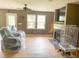 Spacious living room with hardwood floors, fireplace, and a ceiling fan at 101 Langston Ridge Dr, Angier, NC 27501
