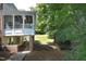 A lovely backyard features a screened porch and a well-manicured lawn, perfect for relaxation and entertainment at 101 Royal Glen Dr, Cary, NC 27518