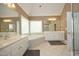 A bright bathroom features a large soaking tub, double sinks, and neutral paint at 101 Royal Glen Dr, Cary, NC 27518