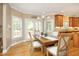 Bright dining area features a chandelier, wood floors, and views of the backyard at 101 Royal Glen Dr, Cary, NC 27518