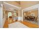 Grand foyer with hardwood floors, staircase, and views into the living and dining areas at 101 Royal Glen Dr, Cary, NC 27518