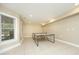 Bright game room featuring a ping pong table and a window for natural light at 101 Royal Glen Dr, Cary, NC 27518