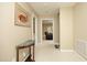 Inviting hallway featuring neutral tones and decor leading to comfortable living spaces at 101 Royal Glen Dr, Cary, NC 27518