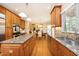 Open kitchen view features granite countertops, stainless appliances, and an open dining space at 101 Royal Glen Dr, Cary, NC 27518
