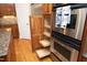 A modern kitchen features a pantry with roll out shelves and stainless steel appliances at 101 Royal Glen Dr, Cary, NC 27518