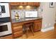 Coffee bar with a countertop, stool, wood drawers, and backsplash artwork at 101 Royal Glen Dr, Cary, NC 27518