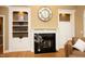 Living room with fireplace, built-in shelving, and decorative details at 101 Royal Glen Dr, Cary, NC 27518