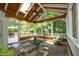 Inviting sunroom with vaulted wood ceiling, skylights, and large windows offering scenic backyard views at 101 Royal Glen Dr, Cary, NC 27518