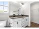 Bathroom with double vanity, granite counters, and ample storage space at 103 Goldenrod Loop, Clayton, NC 27520