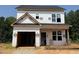New home construction showing framing, window installation, and roof covered at 103 Goldenrod Loop, Clayton, NC 27520