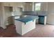Bright kitchen featuring white cabinets, an island, and modern finishes at 1036 Turlington Rd, Dunn, NC 28334