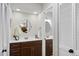 Elegant bathroom featuring a dark wood vanity with dual sinks and plenty of storage space at 107 Wimbledon Ct, Cary, NC 27511
