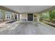 Covered carport and storage area, complete with tools, offering convenient outdoor access and storage space at 107 Wimbledon Ct, Cary, NC 27511