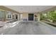 Attached covered parking area and storage with lighting, offering easy access to the house and outdoor equipment at 107 Wimbledon Ct, Cary, NC 27511