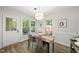 Cozy dining room with access to the back patio offering seamless indoor-outdoor living at 107 Wimbledon Ct, Cary, NC 27511
