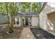 Inviting home entrance highlighting a brick walkway leading to the front door with well-kept landscaping at 107 Wimbledon Ct, Cary, NC 27511