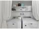 Practical laundry area with modern washer and dryer units for convenient chores at 107 Wimbledon Ct, Cary, NC 27511