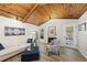 Lovely living room with a wood ceiling, fireplace, and access to the outdoors at 107 Wimbledon Ct, Cary, NC 27511
