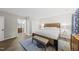 Spacious main bedroom with a wood bed frame and ensuite bathroom and closet at 107 Wimbledon Ct, Cary, NC 27511