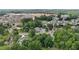 An aerial shot captures a diverse suburban community with lush trees and modern amenities nearby at 1090 S Fifth St, Mebane, NC 27302