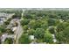 A high aerial view shows the density of the trees in a well-established neighborhood at 1090 S Fifth St, Mebane, NC 27302