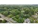 Aerial view of lush treed neighborhood with winding roads and well maintained landscaping at 1090 S Fifth St, Mebane, NC 27302