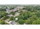 Aerial view of a Gathering-friendly neighborhood with mature trees and various home styles at 1090 S Fifth St, Mebane, NC 27302