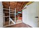 View of attic space with exposed wooden beams, white painted walls, and some flooring at 1090 S Fifth St, Mebane, NC 27302