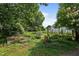 Backyard featuring a garden with raised beds and wooden fencing, perfect for gardening enthusiasts at 1090 S Fifth St, Mebane, NC 27302