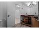 Rustic bathroom featuring a stylish vessel sink atop a repurposed wooden barrel vanity at 1090 S Fifth St, Mebane, NC 27302
