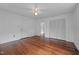 Bright bedroom with beautiful hardwood floors, ceiling fan, and ample closet space at 1090 S Fifth St, Mebane, NC 27302