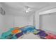 Spacious bedroom featuring a unique painted floor and a ceiling fan at 1090 S Fifth St, Mebane, NC 27302
