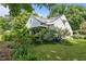 Charming home with a white exterior and beautiful landscaping with lots of curb appeal at 1090 S Fifth St, Mebane, NC 27302