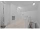 Bright hallway with an air vent, multiple doors, and access to the lower level at 1090 S Fifth St, Mebane, NC 27302