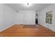 Living room with hardwood flooring, brick accent wall and laundry hook ups at 1090 S Fifth St, Mebane, NC 27302
