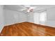Living room features hardwood flooring, neutral walls, and a ceiling fan at 1090 S Fifth St, Mebane, NC 27302