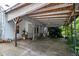 Covered patio with a concrete floor and wooden ceiling, ideal for outdoor entertaining at 1090 S Fifth St, Mebane, NC 27302