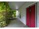 Cozy covered porch with a red door, offering a welcoming entrance to the home at 1090 S Fifth St, Mebane, NC 27302