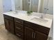 Bathroom showcasing a double sink vanity with dark cabinets and a stylish white countertop at 1116 Sidney Creek Dr # 1116, Zebulon, NC 27597