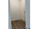 Small hallway with hardwood floors at 1116 Sidney Creek Dr # 1116, Zebulon, NC 27597