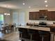 Open floor plan with kitchen island and bar seating that is great for entertaining and eating meals at 1116 Sidney Creek Dr # 1116, Zebulon, NC 27597