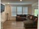 Comfortable living room with plush sectional sofa and ample natural light at 1116 Sidney Creek Dr # 1116, Zebulon, NC 27597