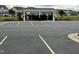 Community parking lot featuring covered mailbox stations and tidy landscaping at 1116 Sidney Creek Dr # 1116, Zebulon, NC 27597