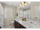 Bathroom with double vanity, marble countertop, and soft natural lighting at 121 Fort Jackson Rd, Morrisville, NC 27560